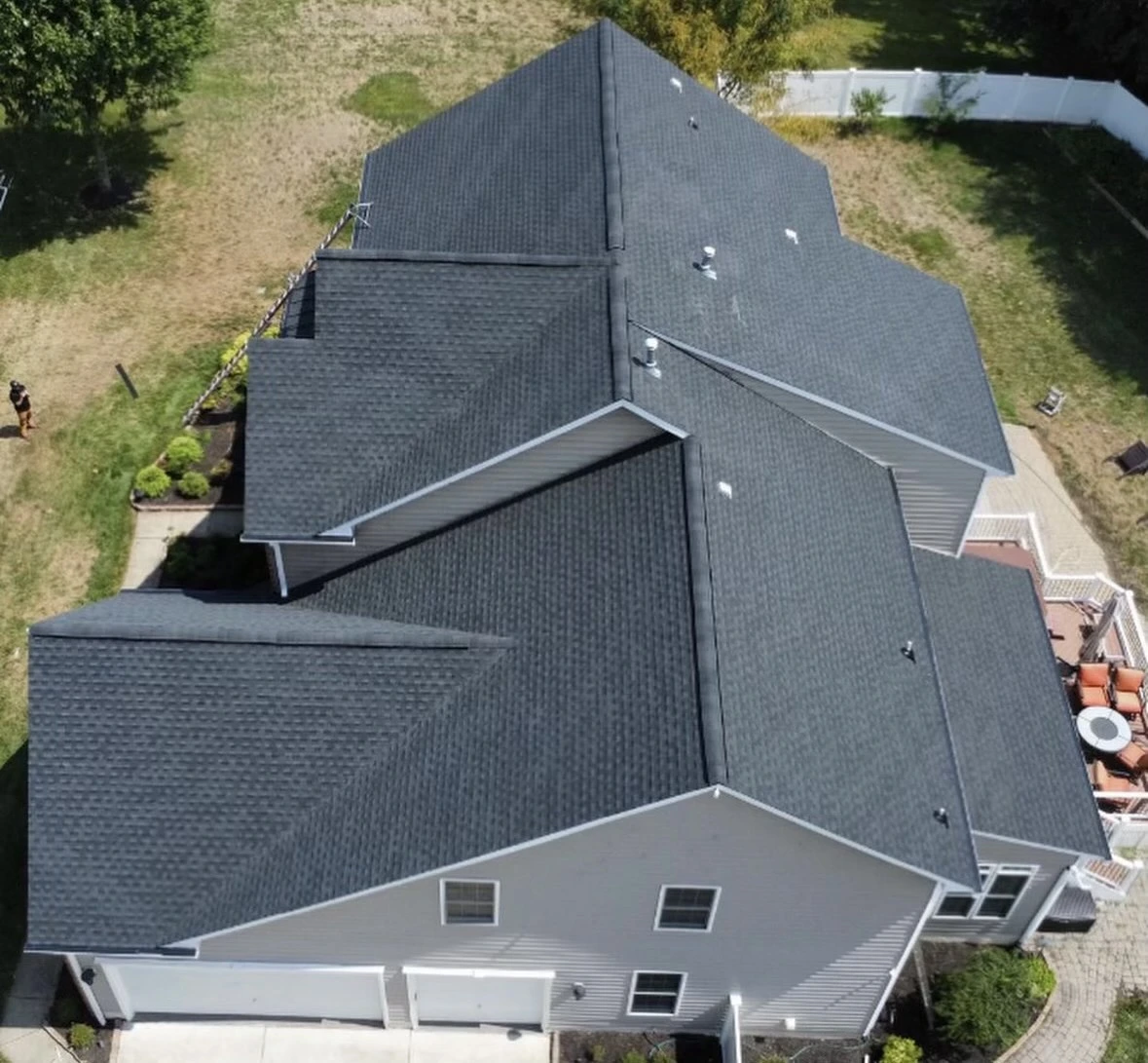 Aerial view of a recently replaced dark asphalt shingle roof in Bowie, Maryland